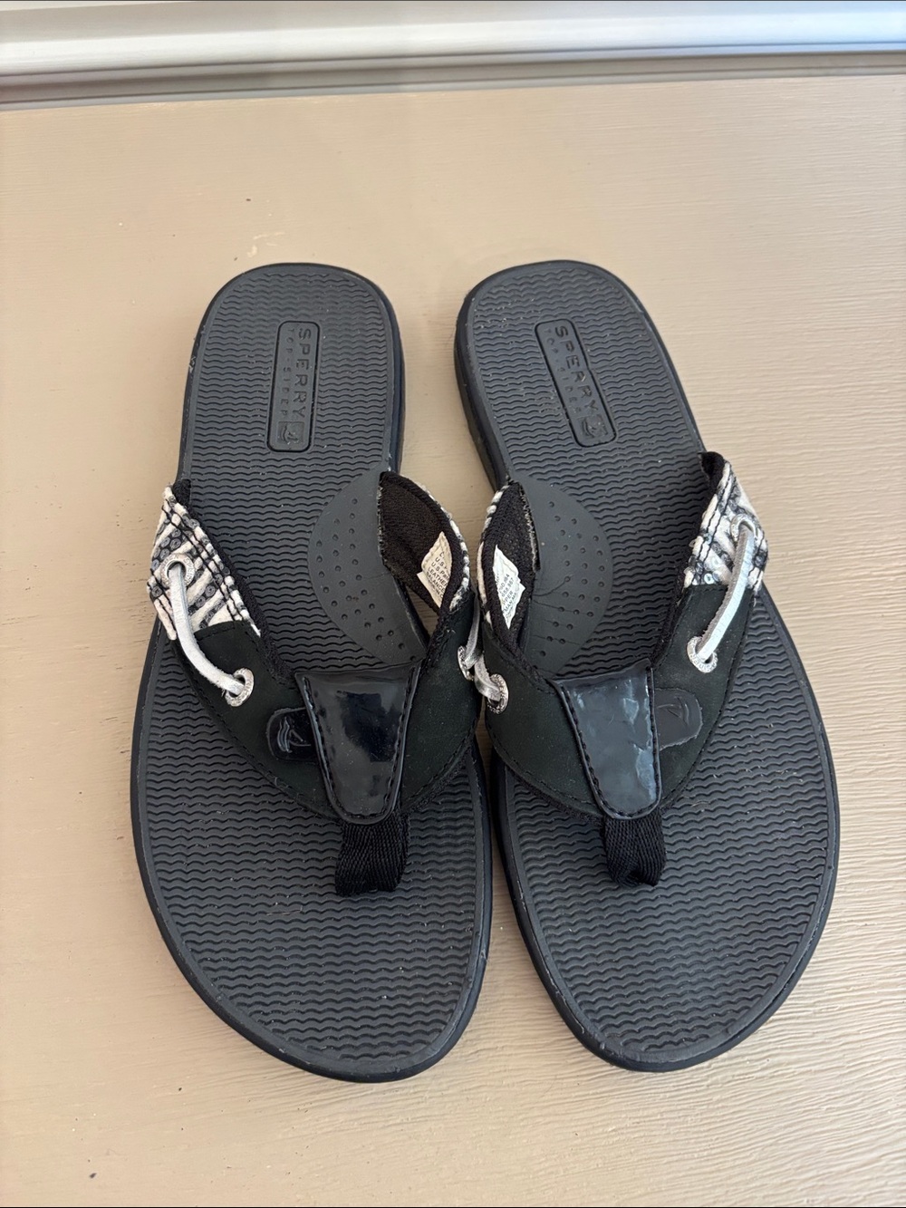 Sperry Black Flip Flop Sandals with Zebra Patterned Strap Accents